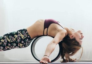 stretching with yoga wheel